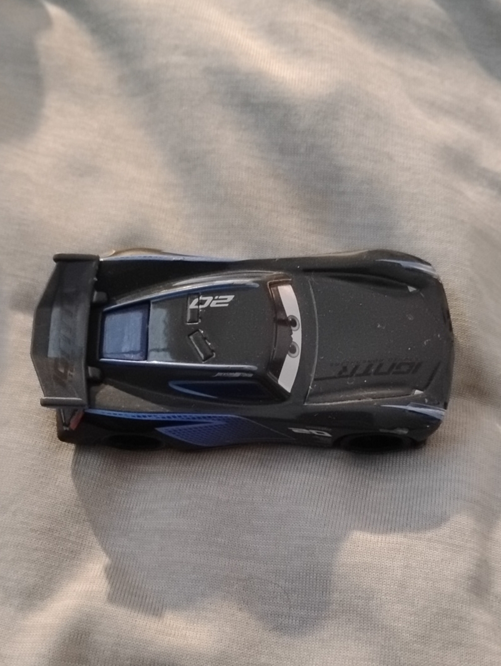 Jackson Storm With Spoiler Die-Cast Toy Race Car with Blue Accents